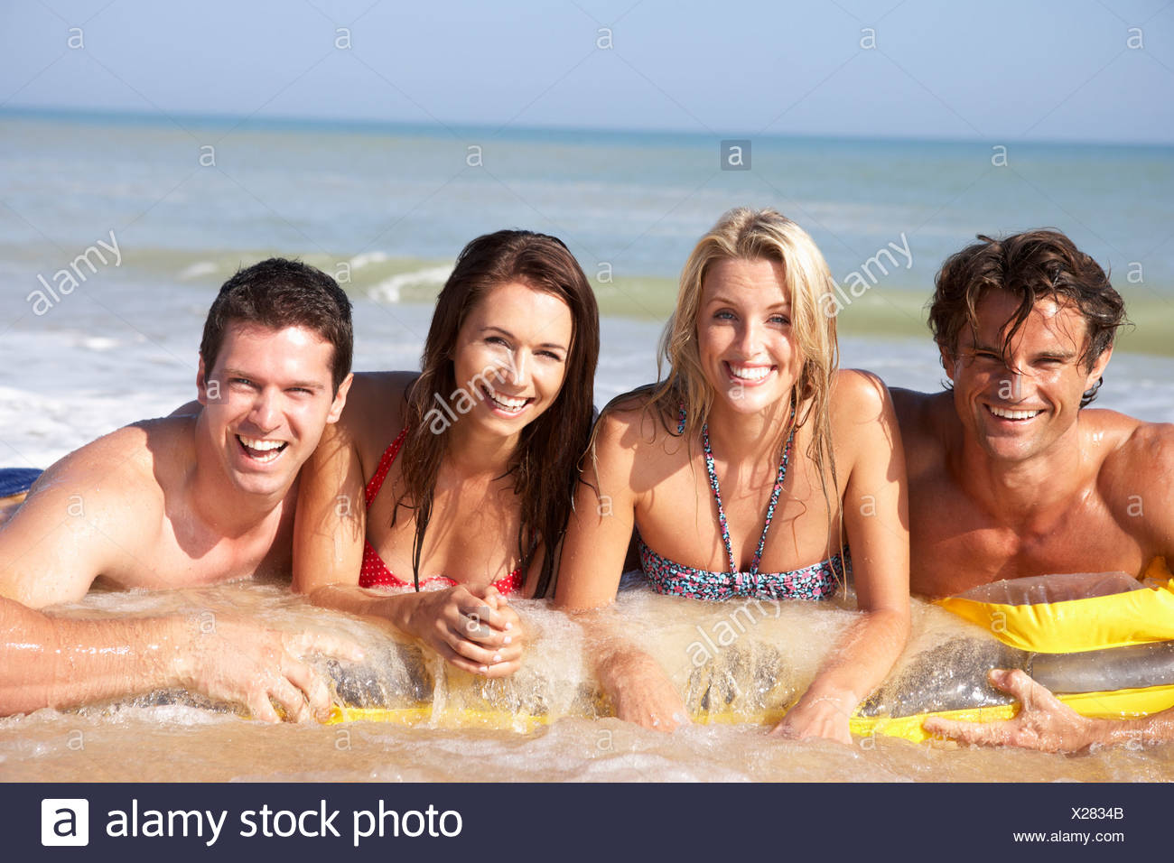 Two Young Couples On Beach Holiday Stock Photo 276773291