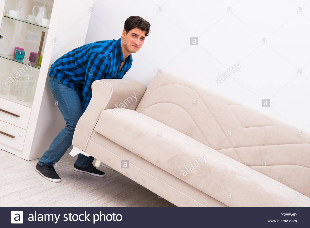 Young Man Moving Sofa Couch Stock Photo 276775458 Alamy