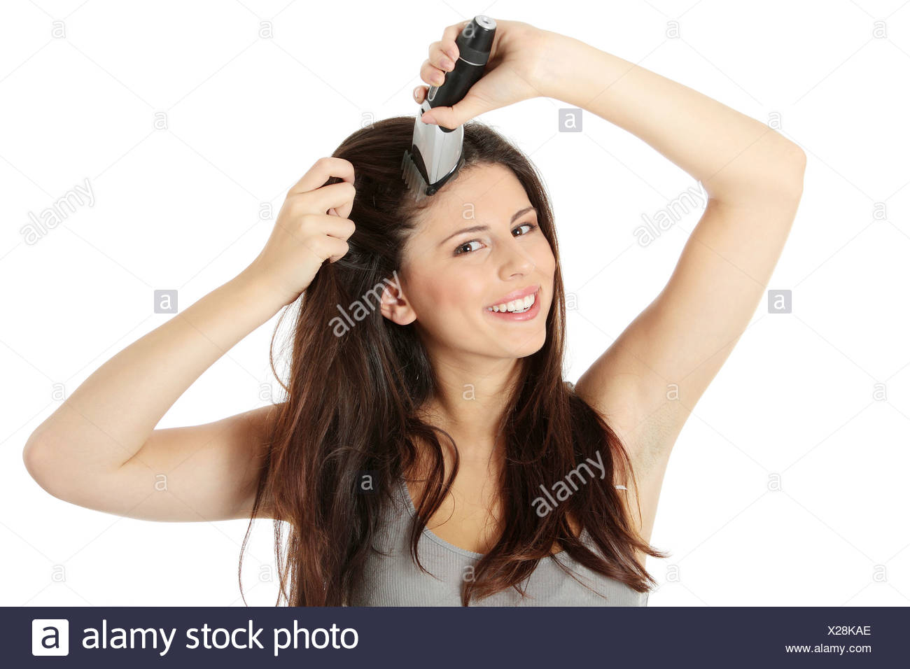 cutting a woman's hair with clippers