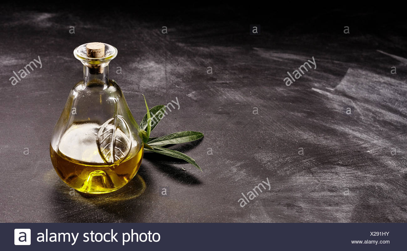 Close Up Still Life Of Small Decorative Glass Bottle Of Olive Oil