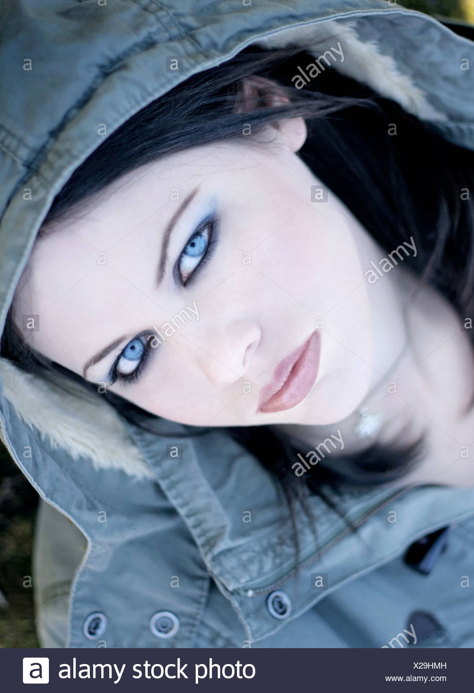 Video Portrait Of Curly Woman That Opes Her Blue Eyes And Smiles Attractive Woman With Piercing In Her Nose Woman With Big Blue Eyes