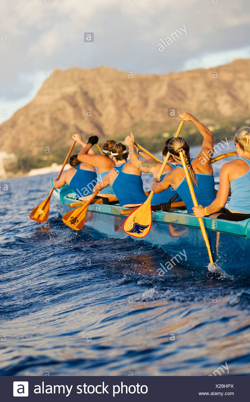 Hawaii, Oahu, Female Outrigger Canoe Team Paddling Towards Diamond Head