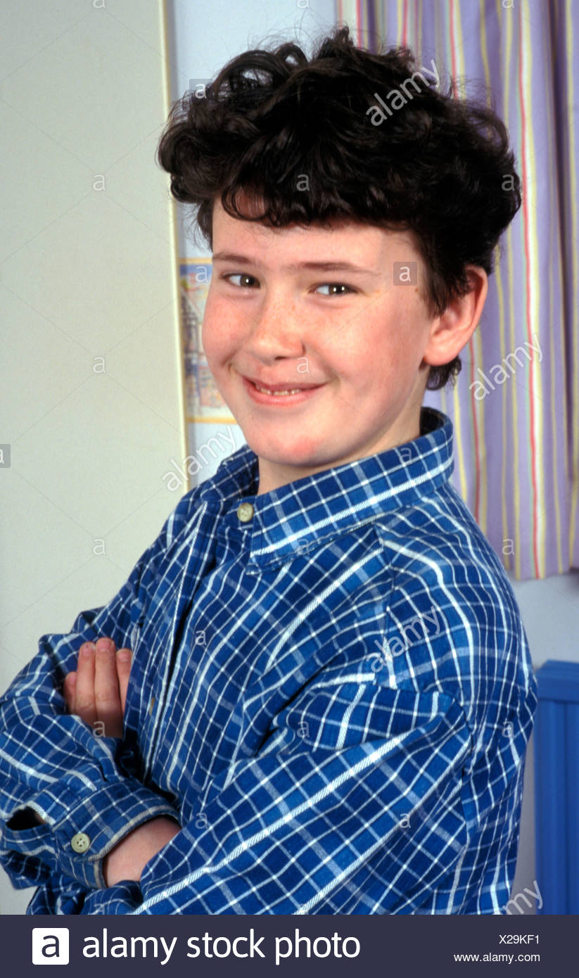 Portrait Smiling Teenage Boy With Black Curly Hair Stock