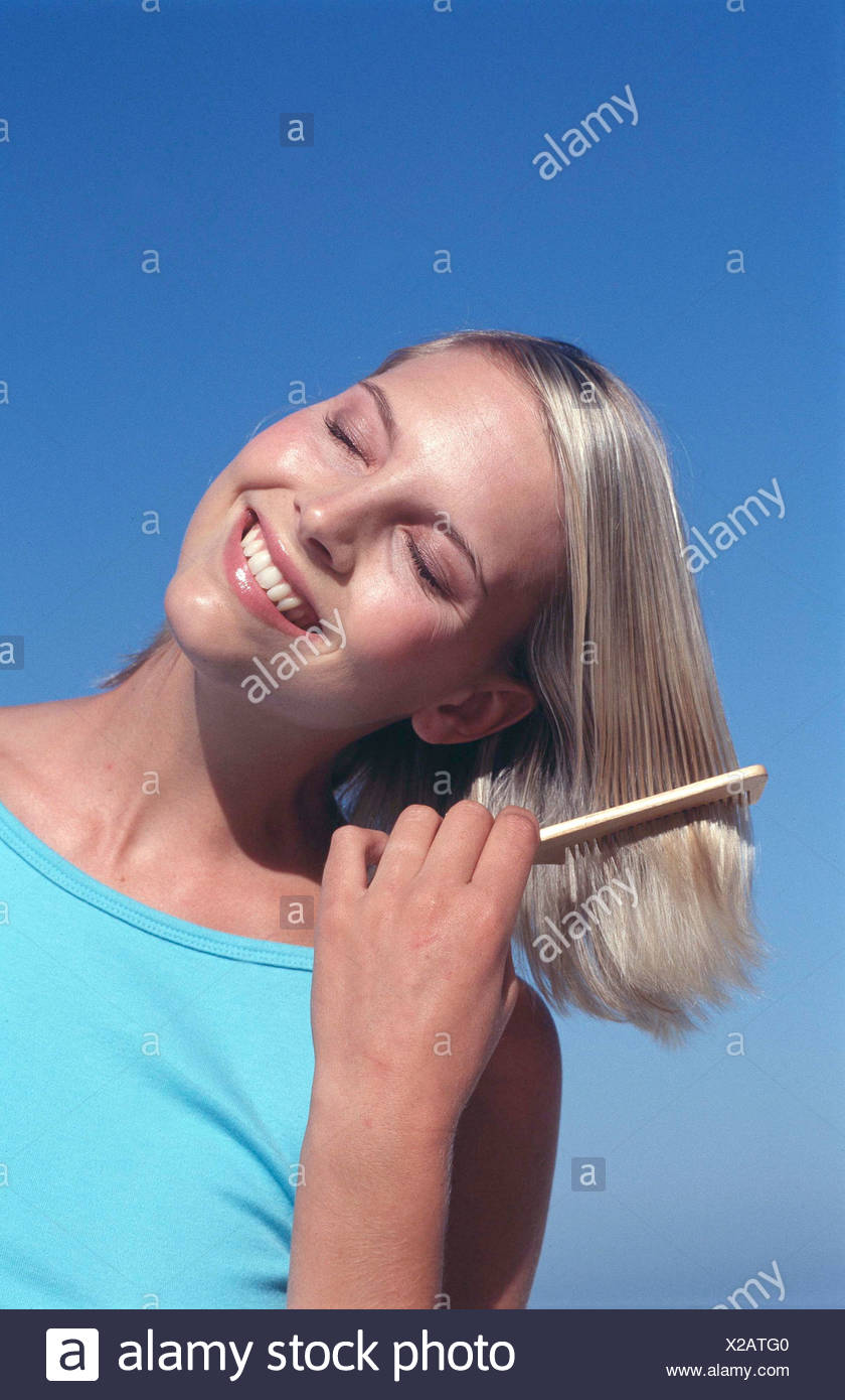 Tanned Female Chin Length Blonde Hair Wearing Subtle Make Up