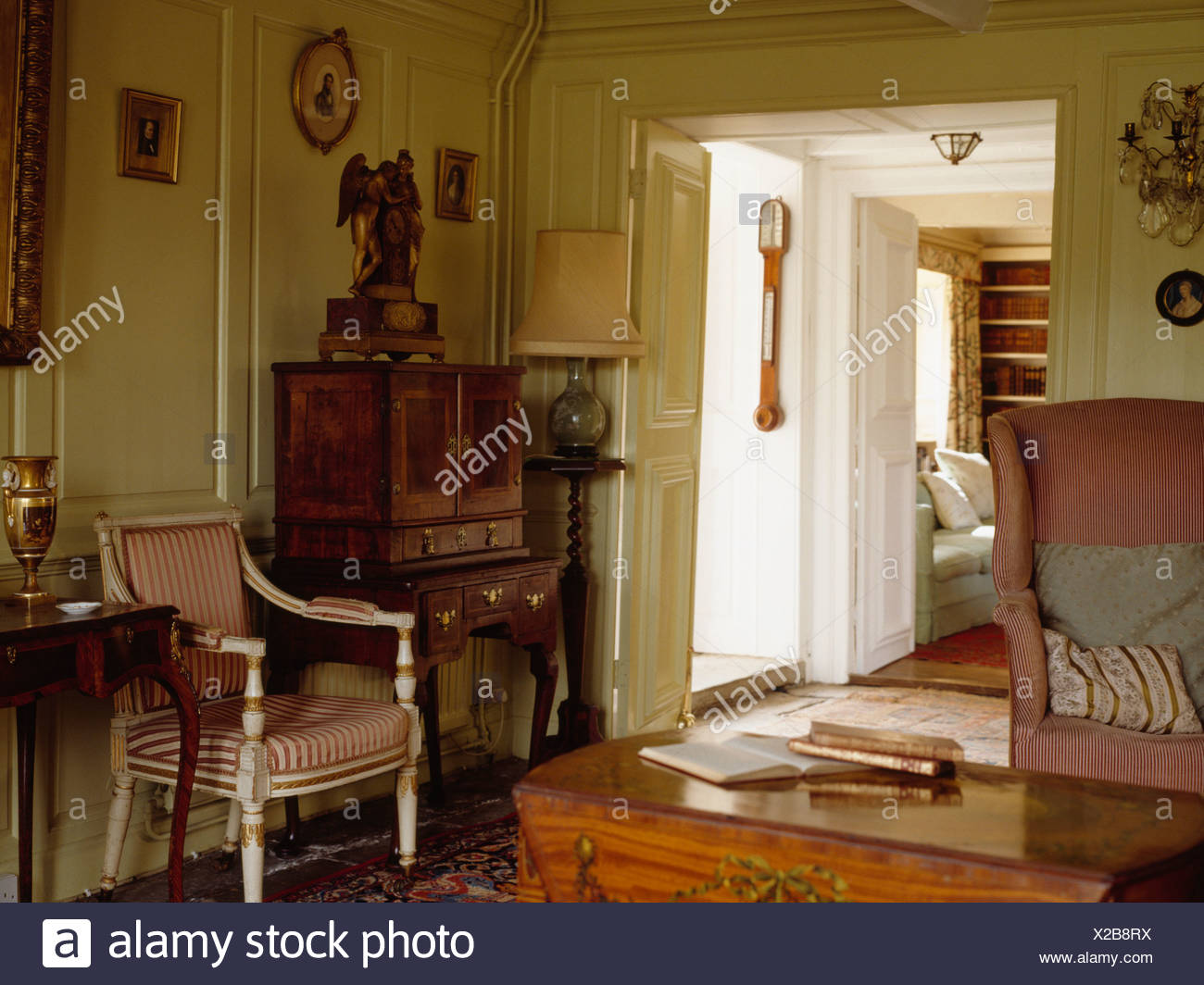 Antique Desk And Striped Chair In Cream Paneled Cottage