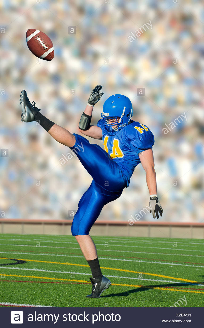 Footballer Kicking Ball Stock Photos & Footballer Kicking Ball Stock