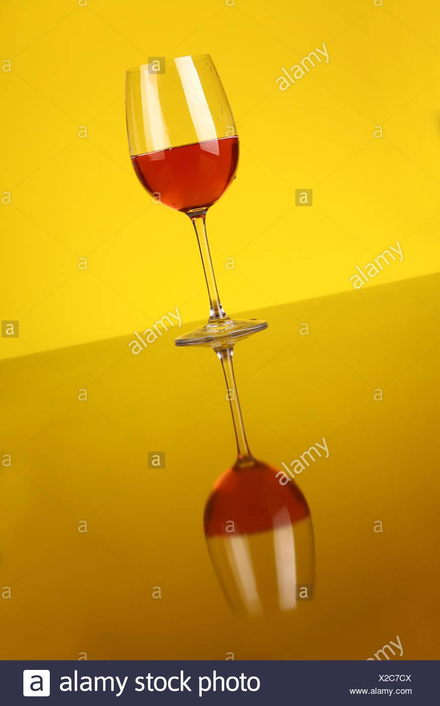 Download Glass Of Rose Wine Over A Yellow Background Stock Photo Alamy Yellowimages Mockups