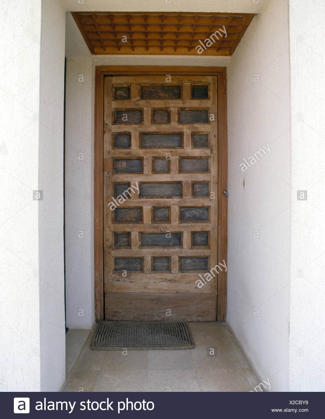 Close Up Of A Carved Wooden Front Door Of Spanish Villa Stock