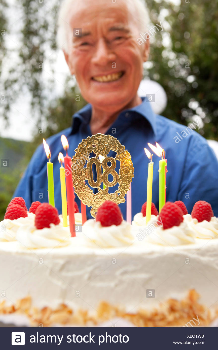 Senior Man Holding 80th Birthday Cake Stock Photo Alamy