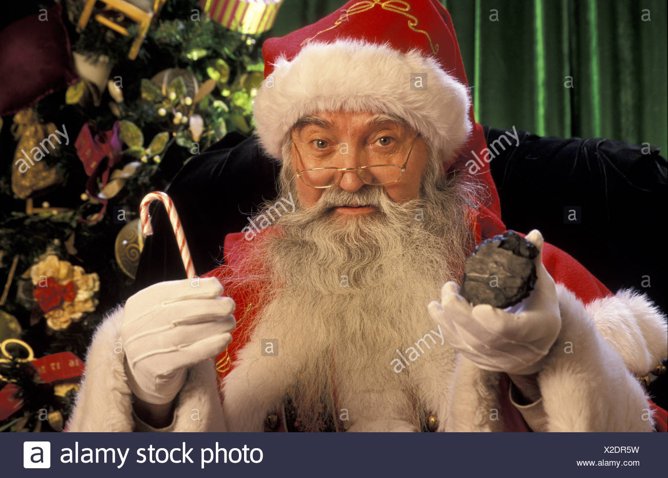 Santa Claus Holding A Piece Of Coal Portrait Nw W O Candy Canes Stock Photo Alamy