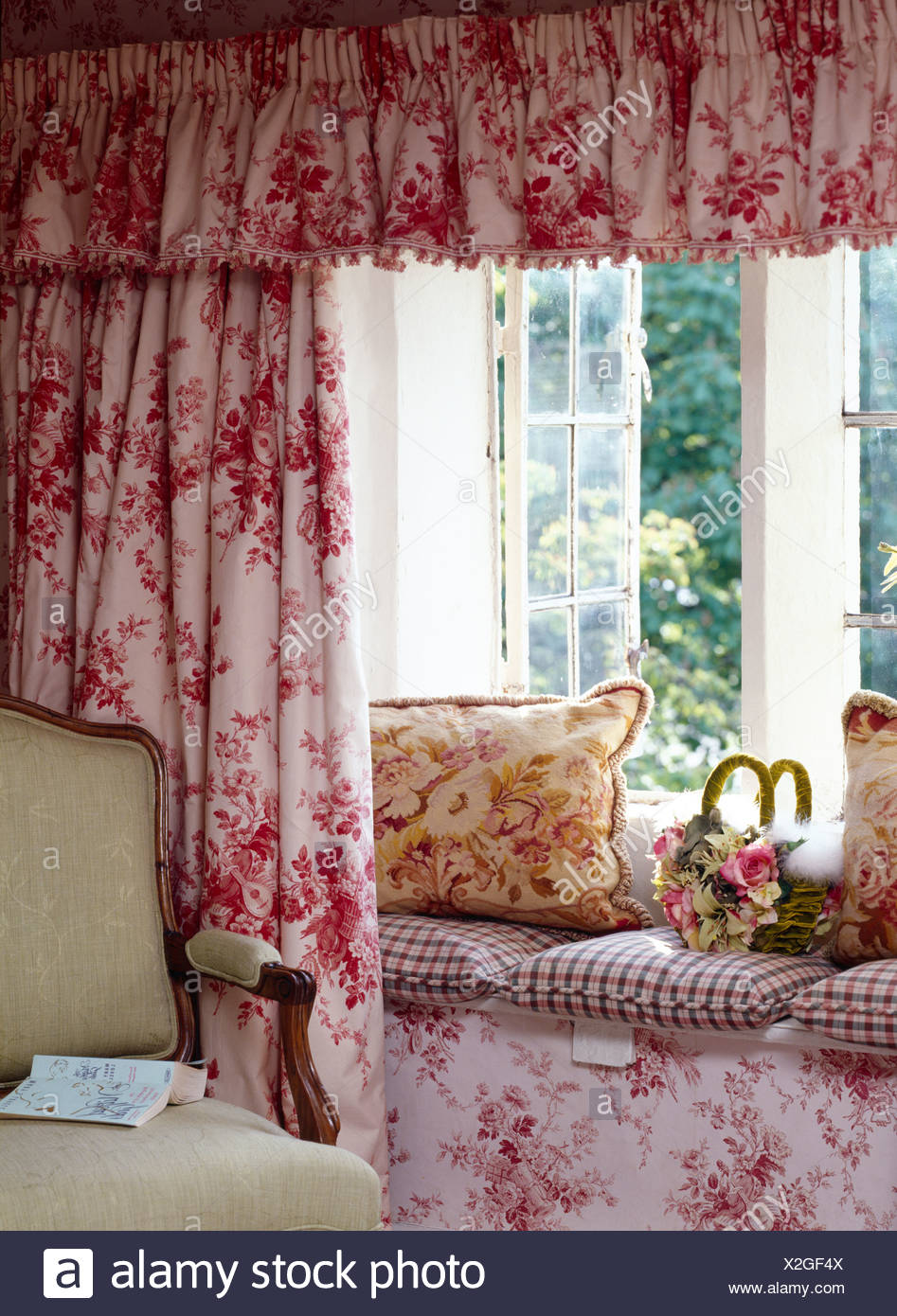 Pink Floral Curtains And Pelmet On Open Window Above Window Seat With Floral And Checked Cushions In Cottage Living Room Stock Photo Alamy Pink Floral Curtains And Pelmet On Open Window Above Window Seat With Floral And Checked Cushions In Cottage Living Room Stock Photo Alamy