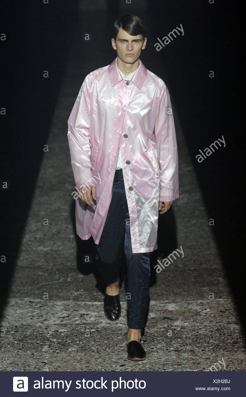 Dries Van Noten Milan Menswear Ready to Wear Spring Summer Model wearing  pink plastic raincoat over white shirt blue satin Stock Photo - Alamy