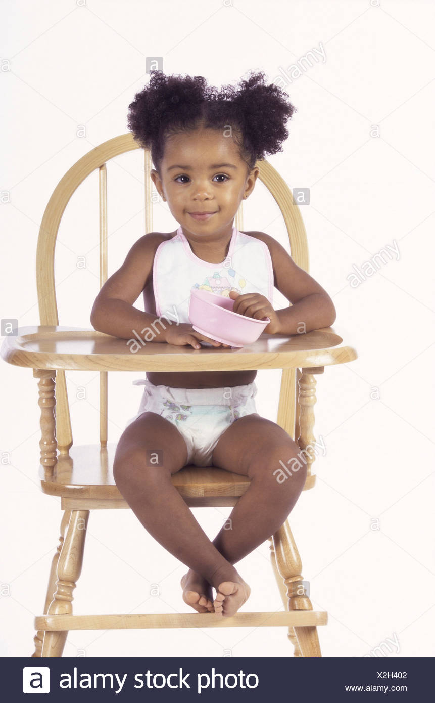 sitting in a high chair