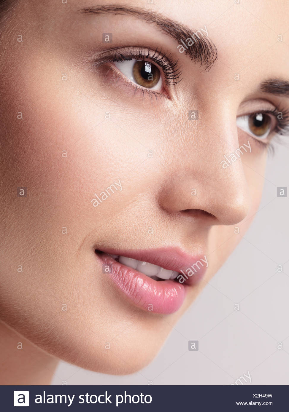 Close Up Of A Young Beautiful Woman Face With Brown Eyes Clean