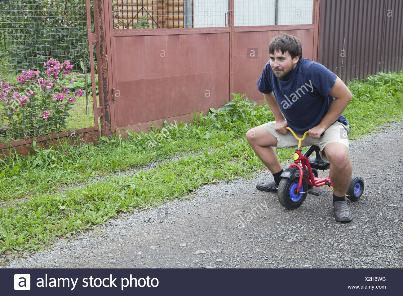 adult riding tricycle