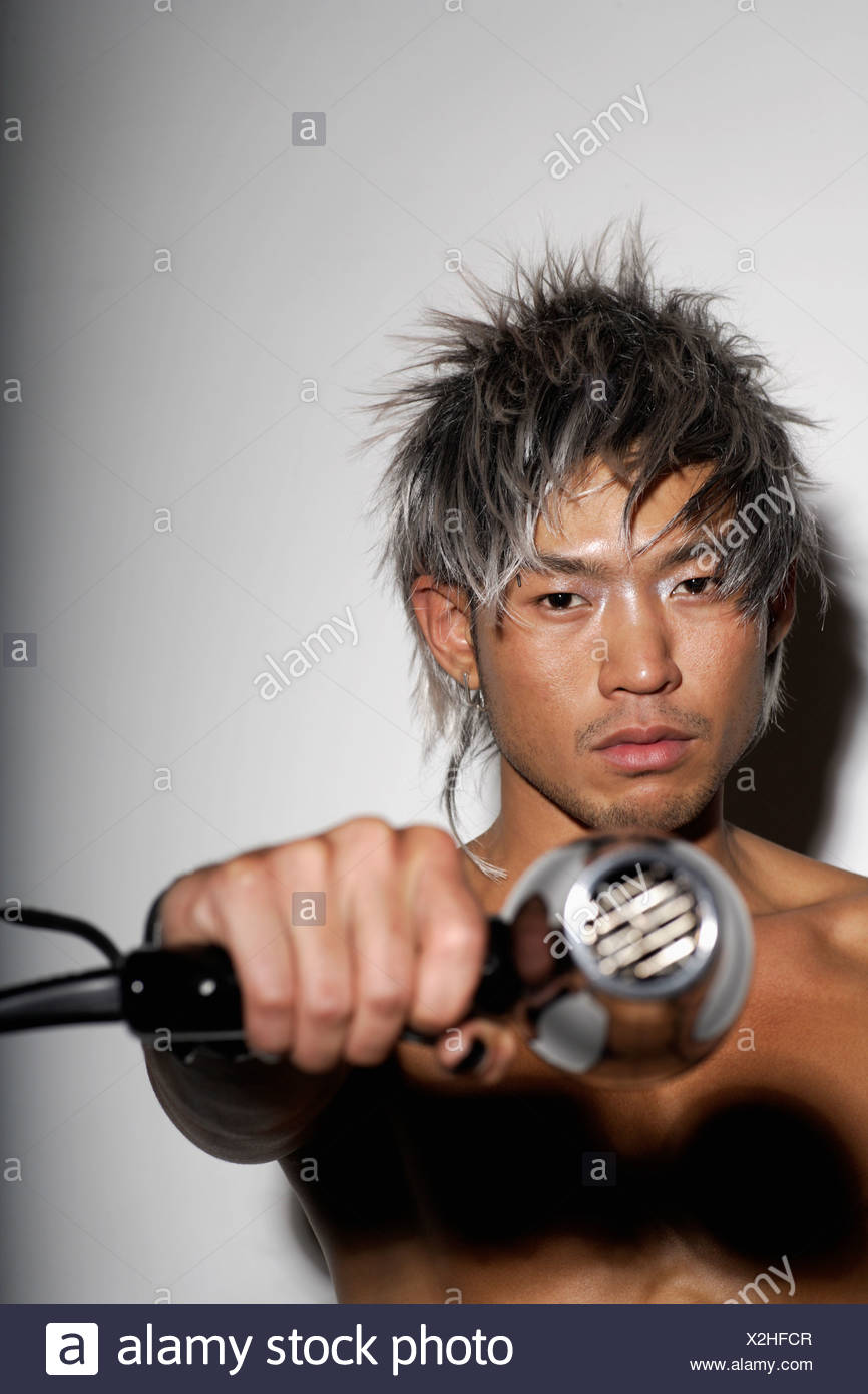 Head Shot Of Young Man With Silver Hair Holding Silver Hair Dryer