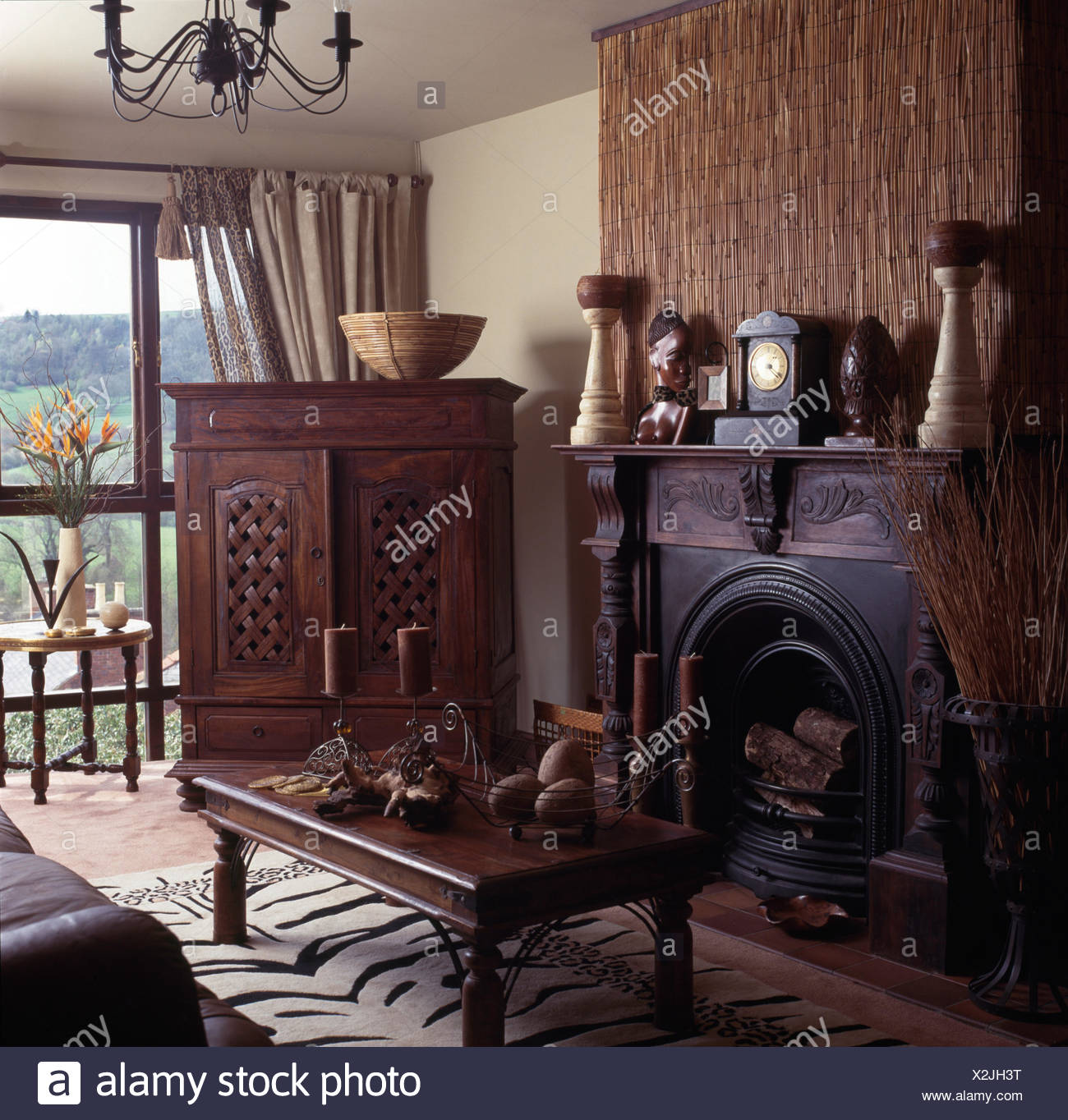 Pinoleum Screen Above Cast Iron Fireplace In An Ethnic Style