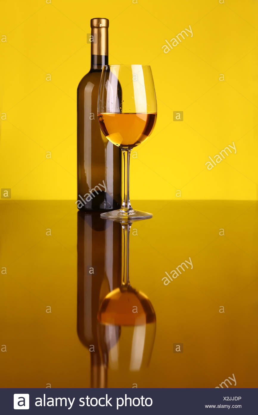 Download Glass And Bottle Of White Wine Over A Yellow Background Stock Photo Alamy PSD Mockup Templates