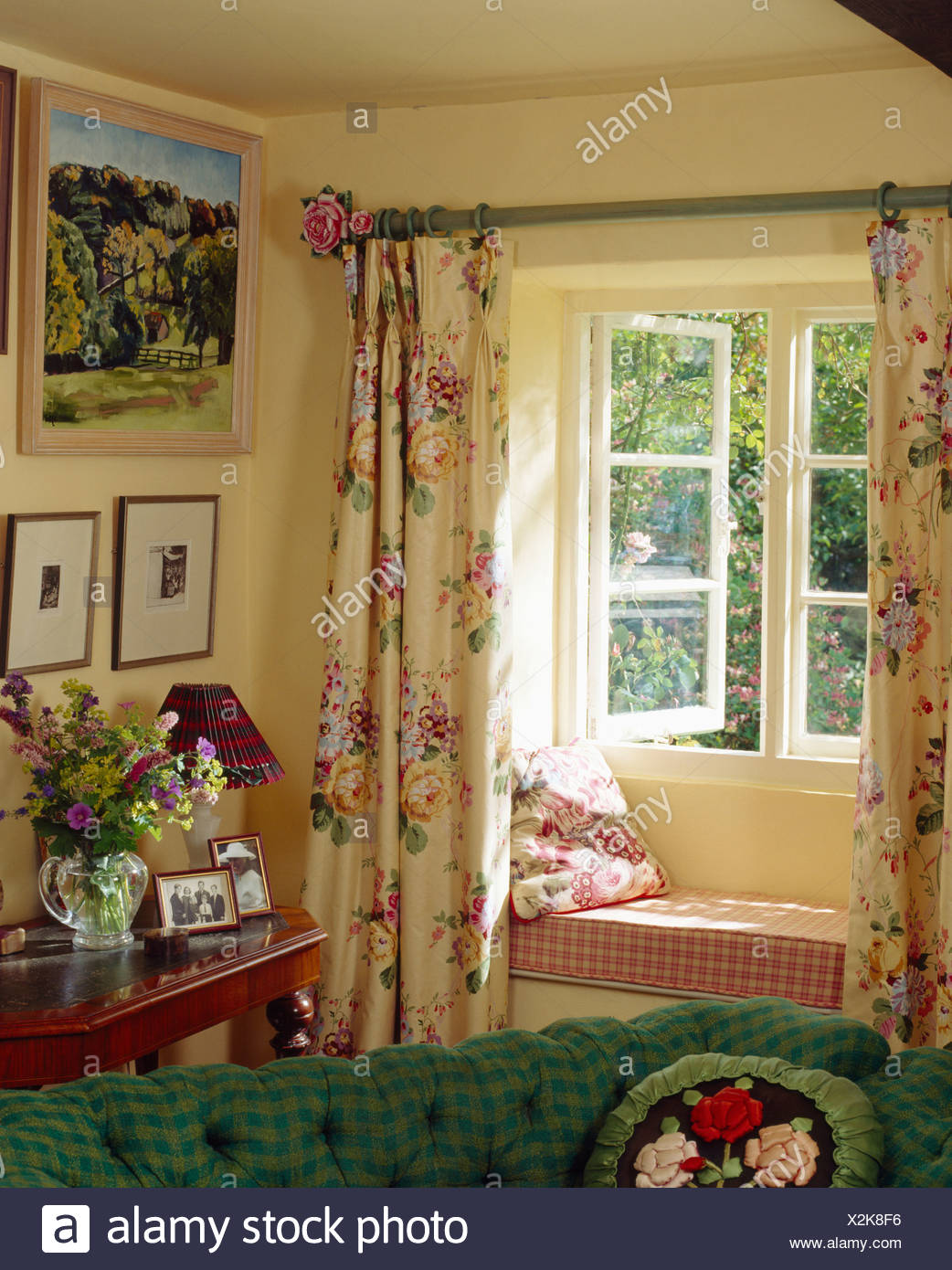 Cottage Living Room With Floral Curtains On Window With Checked Cushion On Window Seat Stock Photo Alamy