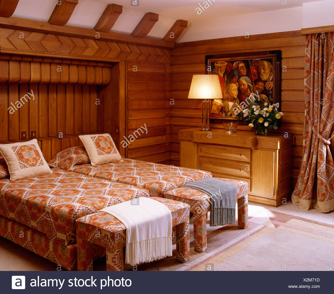 Twin Beds With Patterned Covers And Co Ordinating Upholstered
