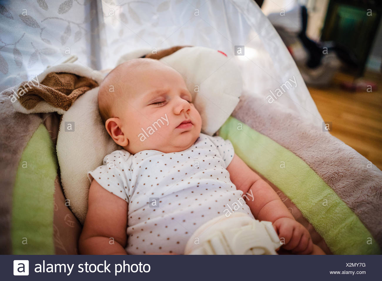 infant sleeping in bouncer
