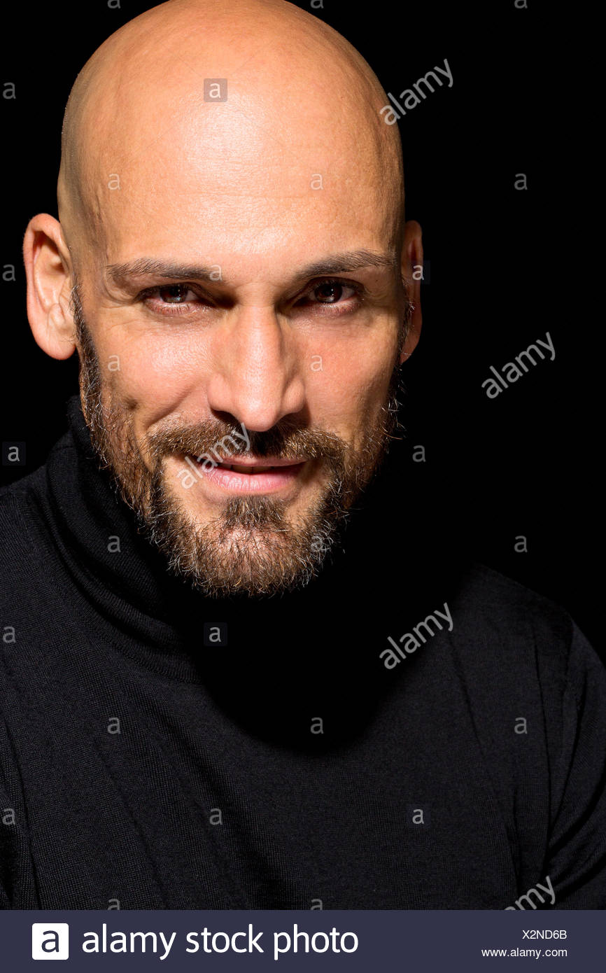 bald man turtleneck
