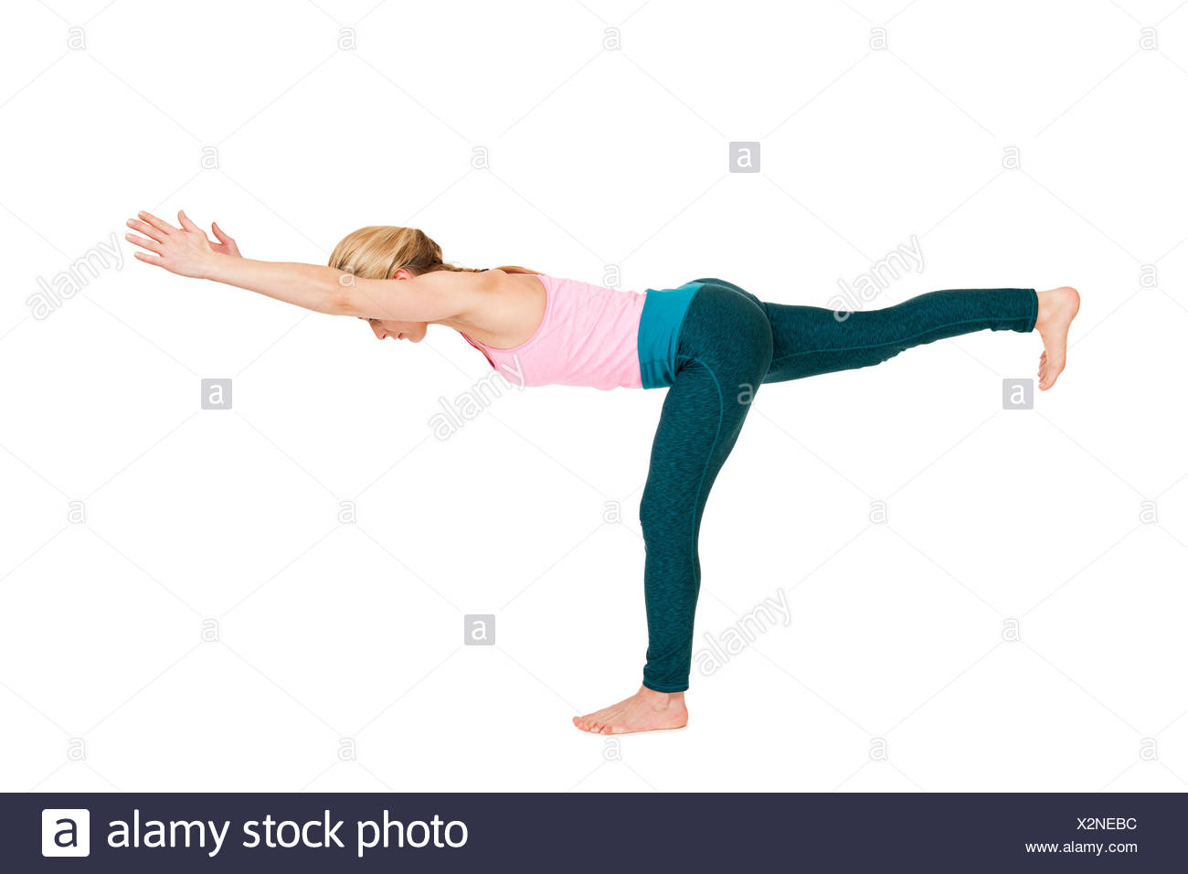 yoga woman pink_virabhadrasana_iii Stock Photo
