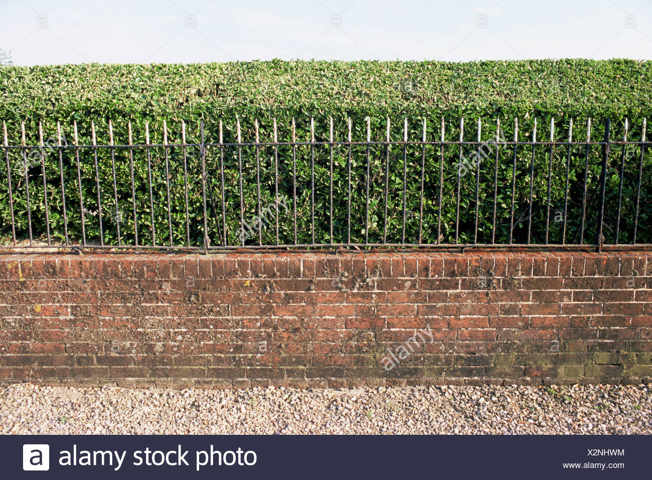Hedge And Brick Wall Stock Photos & Hedge And Brick Wall Stock Images