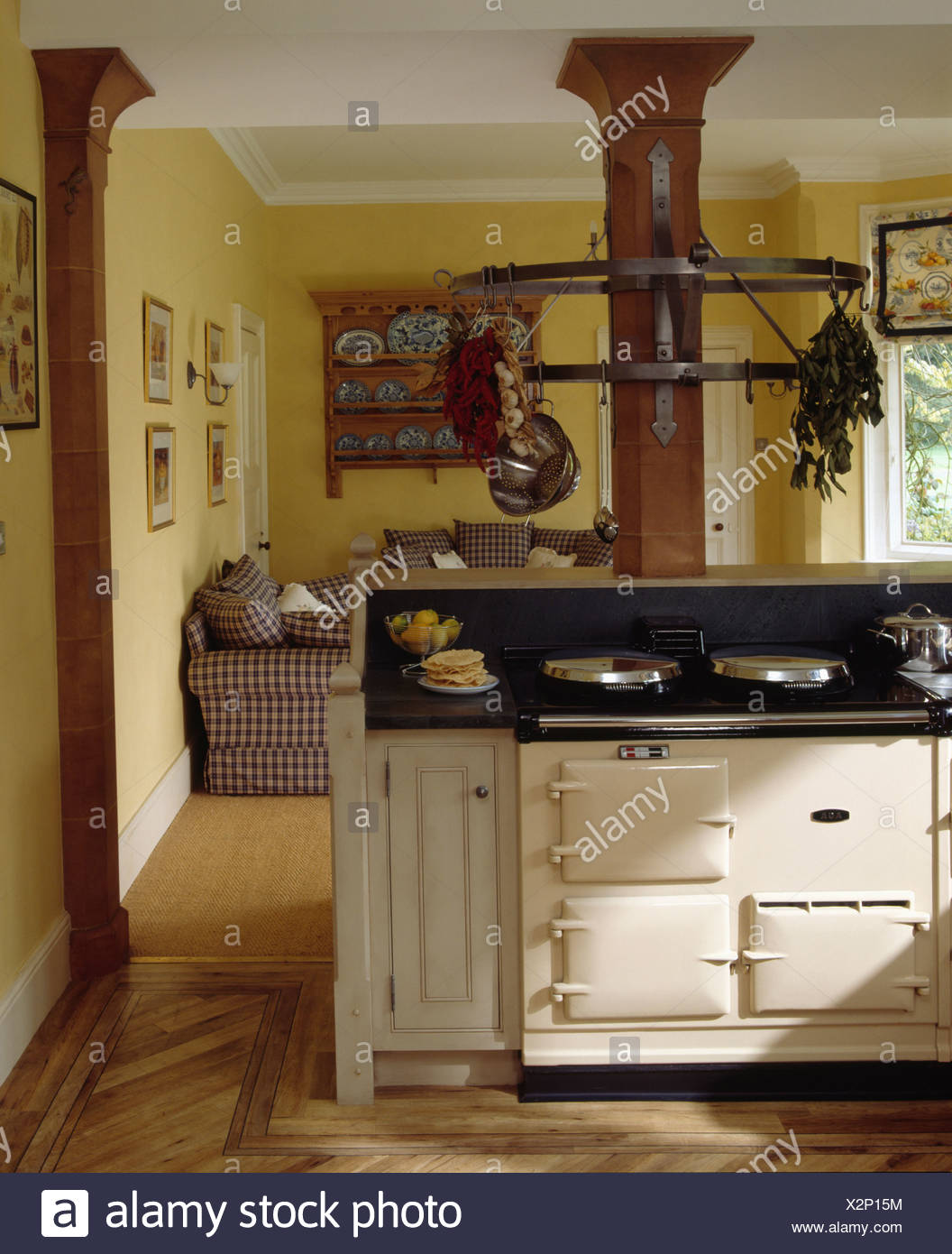 Cream Aga cooker in large openplan country kitchen with 