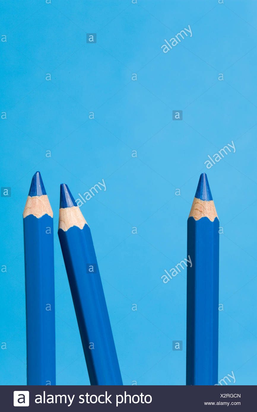 Three blue crayons Stock Photo