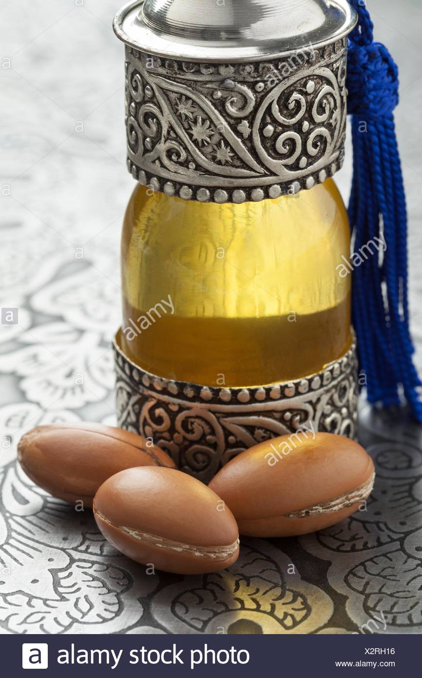 Download Bottle With Moroccan Argan Oil And Nuts Stock Photo Alamy PSD Mockup Templates