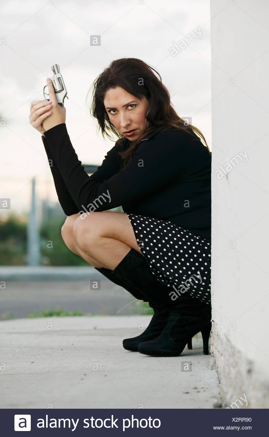 https://c8.alamy.com/comp/X2RR90/woman-female-mexican-gun-firearm-photo-model-model-hispanic-beauty-woman-skirt-X2RR90.jpg