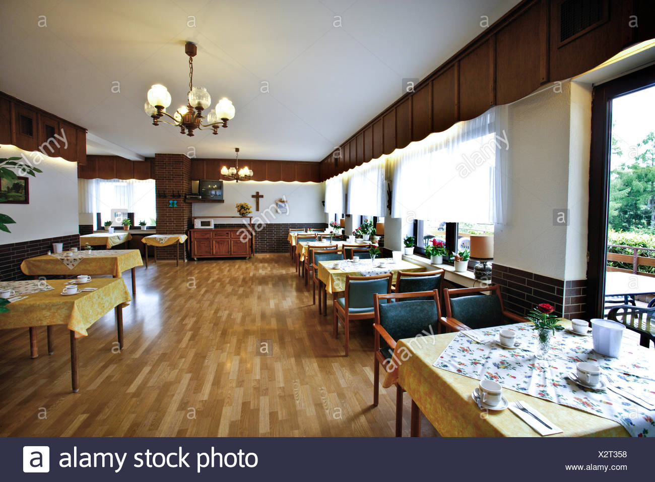 Set Tables In The Dining Hall Of A Nursing Home Stock Photo