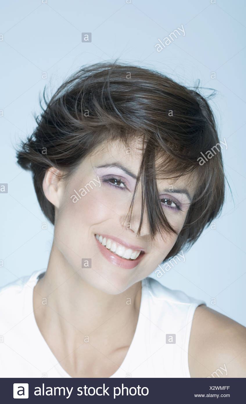 Woman With Short Hair Strand Of Hair In Front Of Face Smiling