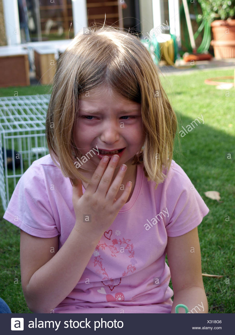 Female Child With Dark Blonde Shoulder Length Hair Wearing