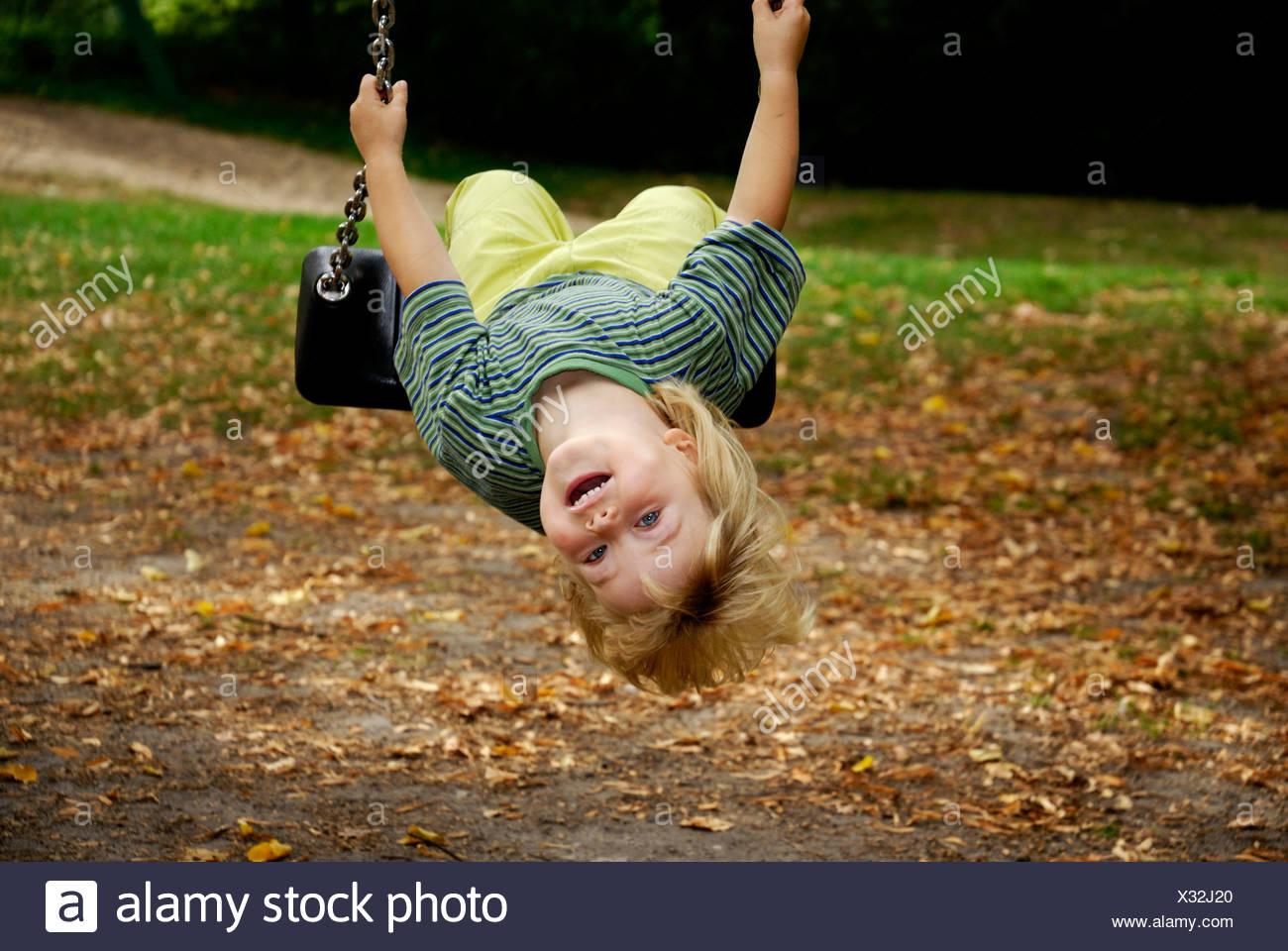 Little Girl Laughing Upside Down High Resolution Stock Photography and