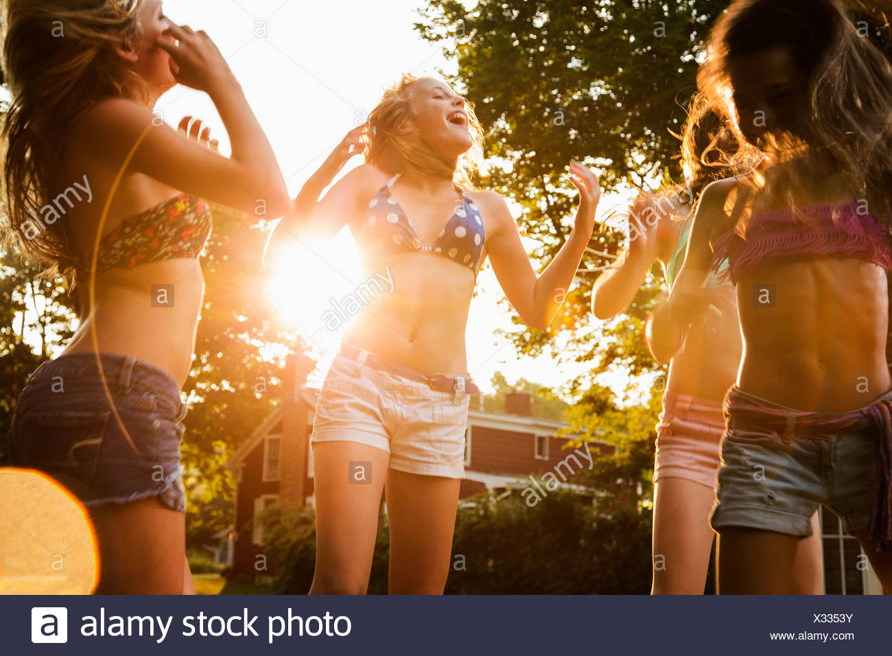 Girls dancing in garden Stock Photo