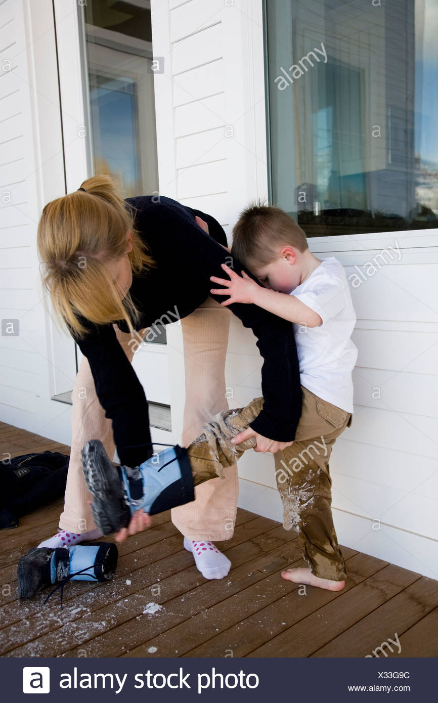 Taking Boots Off High Resolution Stock Photography and Images Alamy