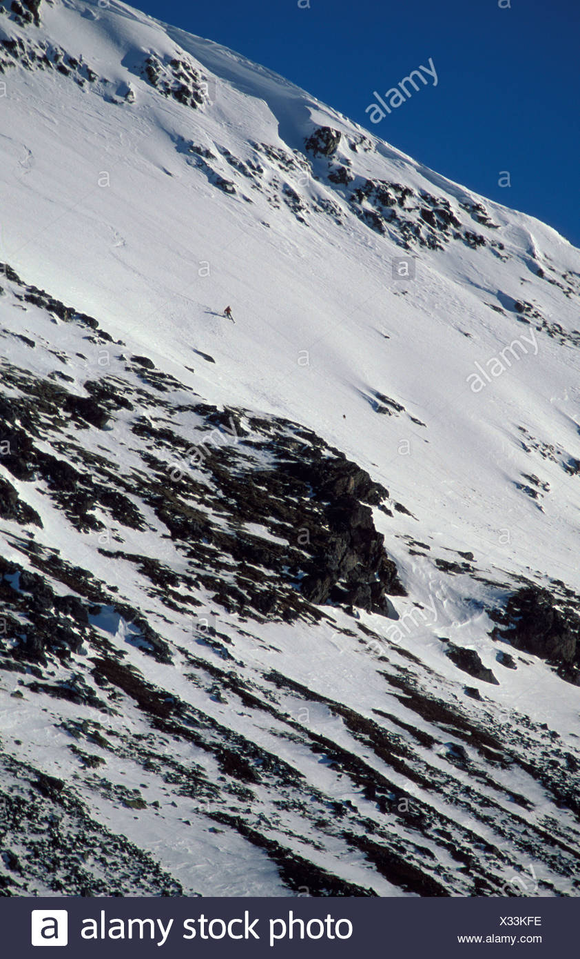 Free Heel Skier skiing down steep slope Norway Stock Photo ...