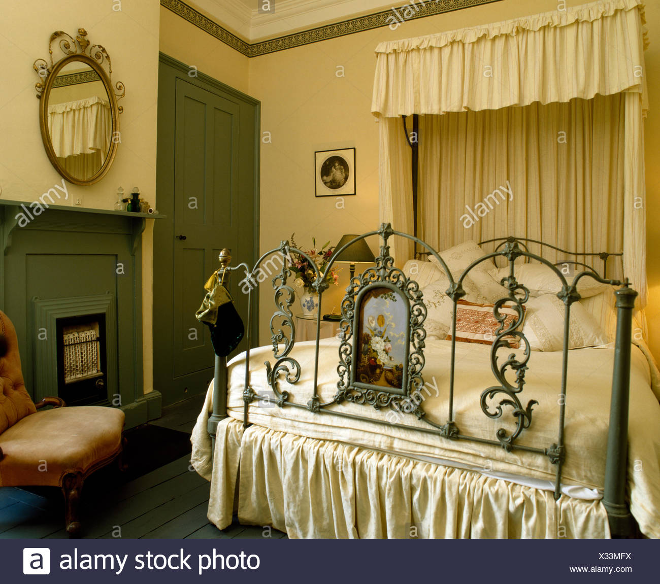 Cream Drapes On Ornate Painted Antique Half Tester Bed In