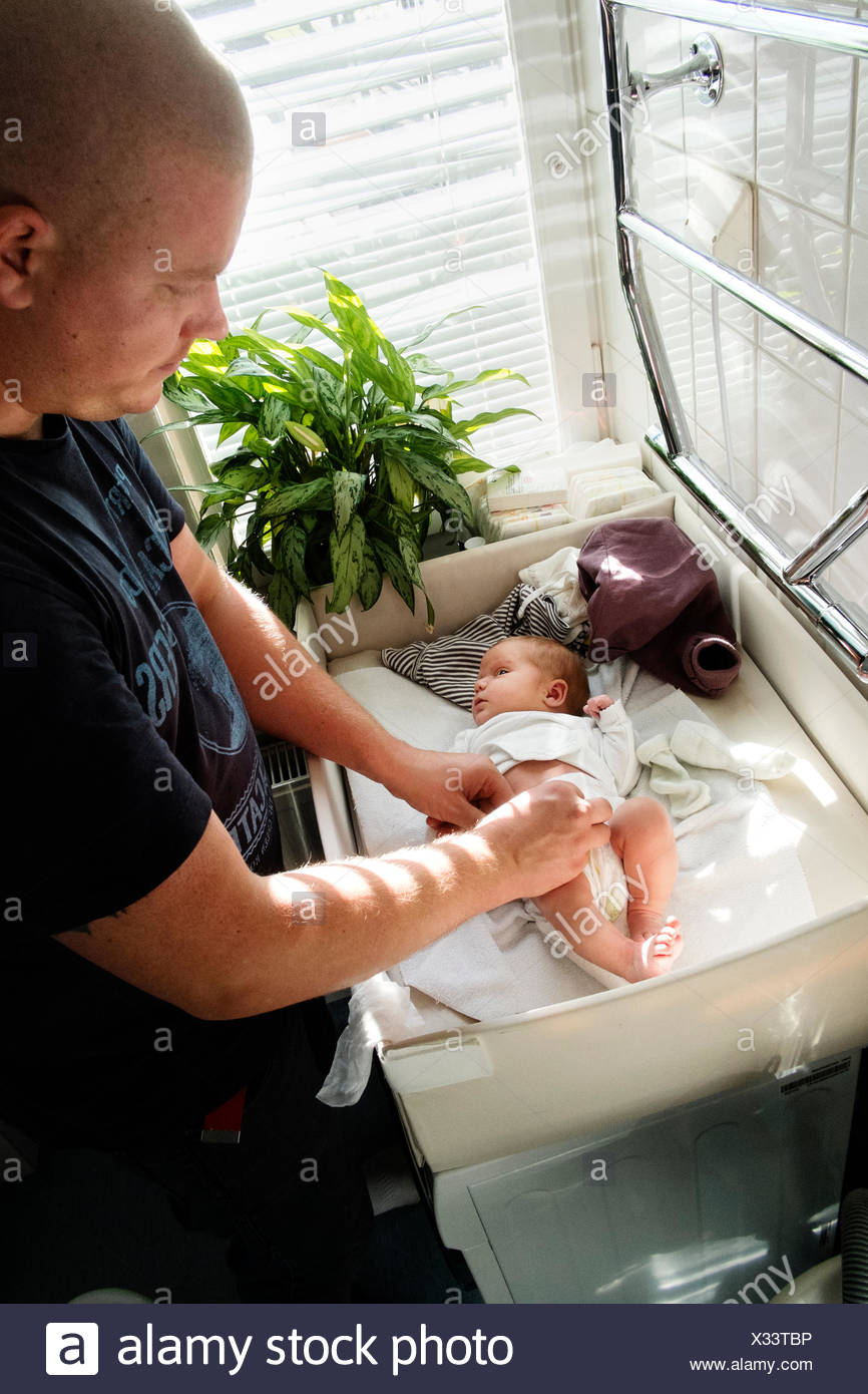 Man Changing Baby Diaper Stock Photos & Man Changing Baby Diaper Stock