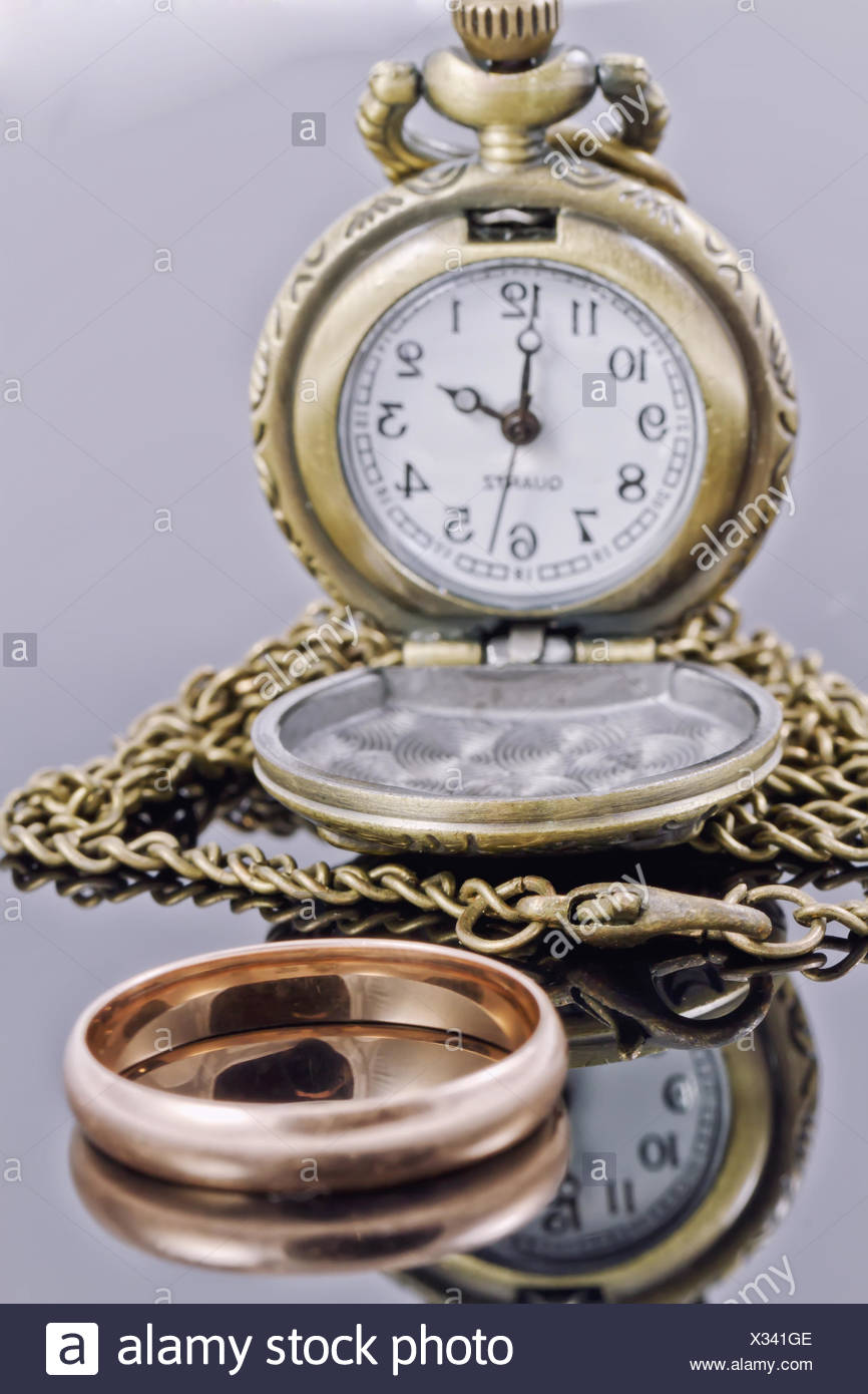 Pocket Watch And A Gold Wedding Ring Stock Photo Alamy
