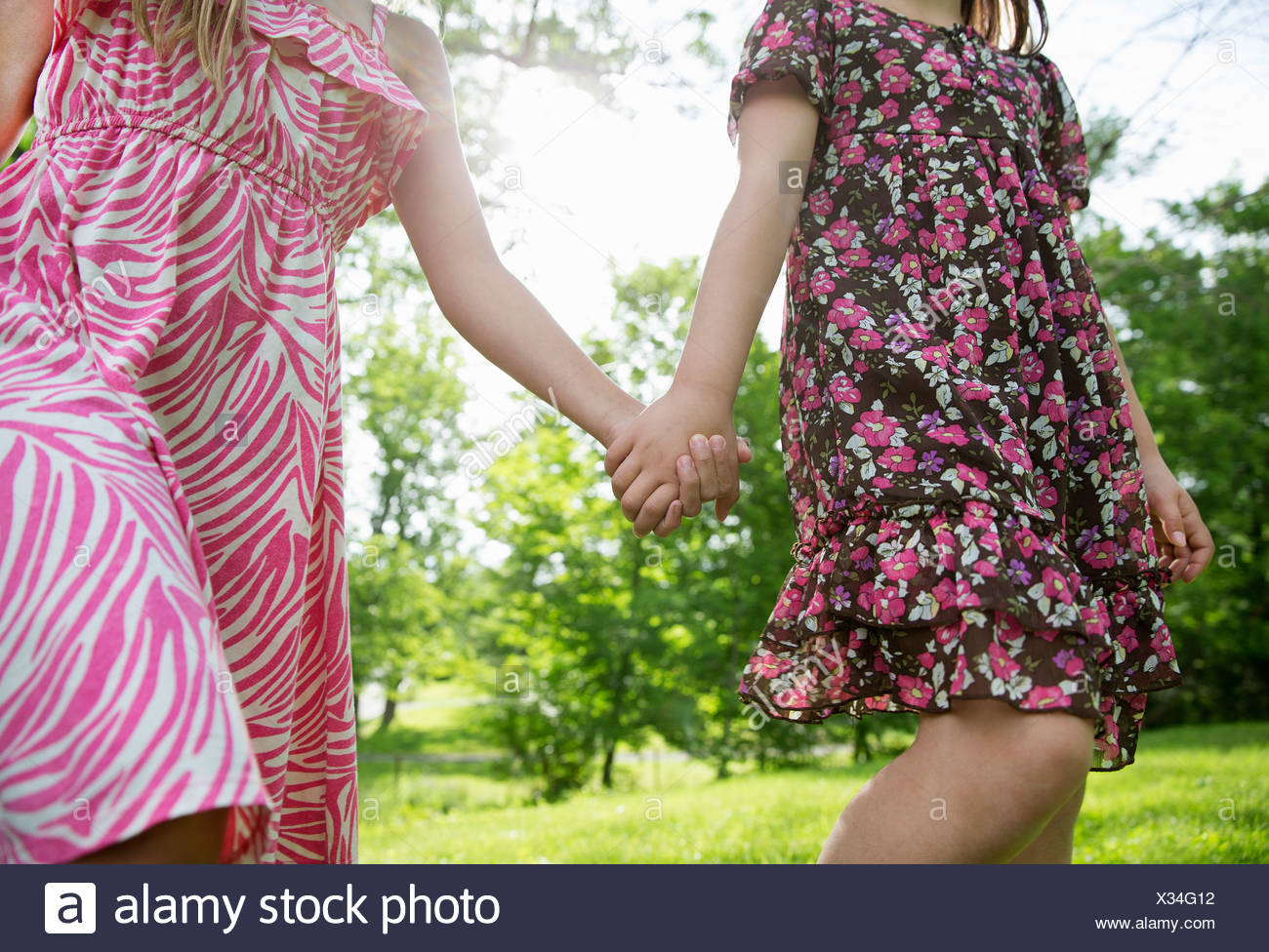 Three Girls Holding Hands High Resolution Stock Photography and Images ...