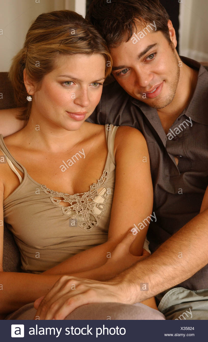 Couple Sitting In Loveseat Male Short Wavy Chestnut Hair Wearing