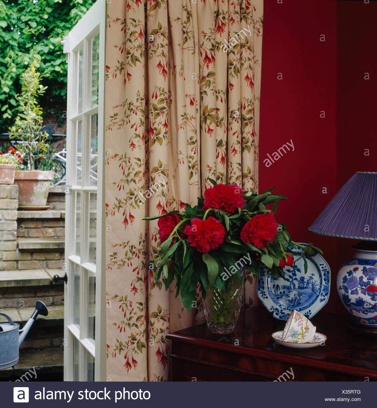 Red Peonies In Vase On Table Beside French Window With Floral Curtains In Country Dining Room Stock Photo Alamy Red Peonies In Vase On Table Beside French Window With Floral Curtains In Country Dining Room Stock Photo Alamy