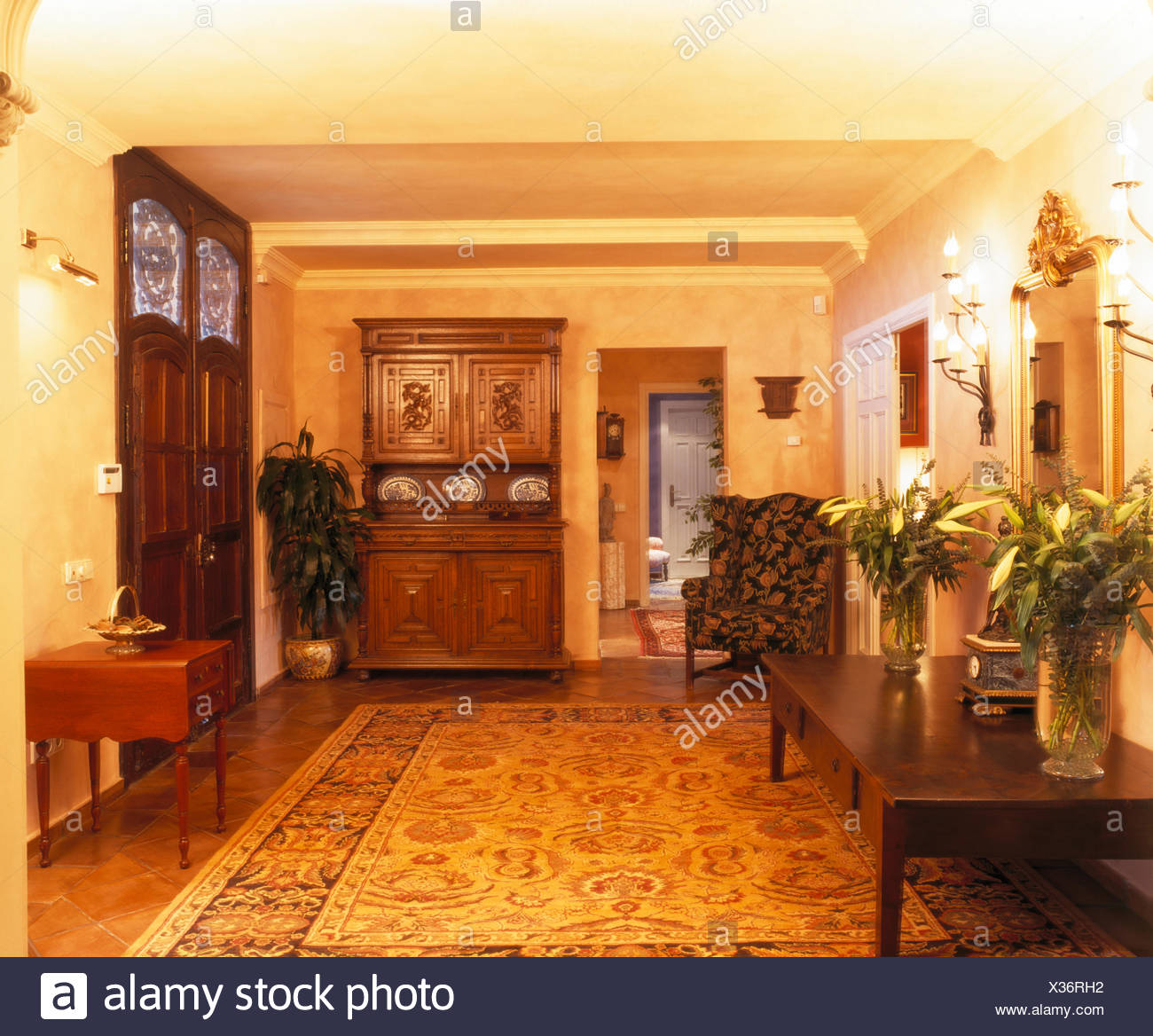 Large Patterned Rug And Carved Wooden Dresser In Hall With Vases