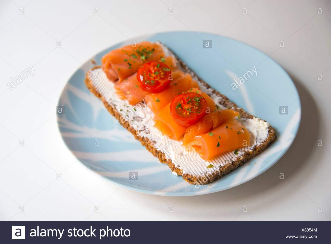 Smoked Salmon And Cottage Cheese Cream On Toast With Cherry