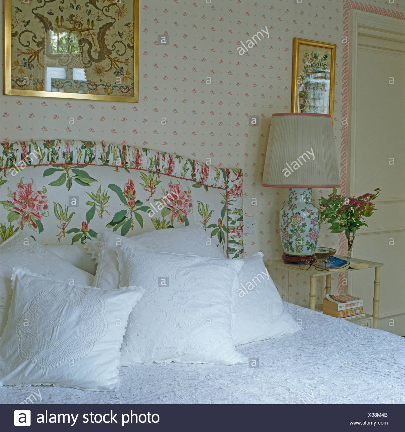 White Lace Edged Cushions On Bed With Upholstered Floral