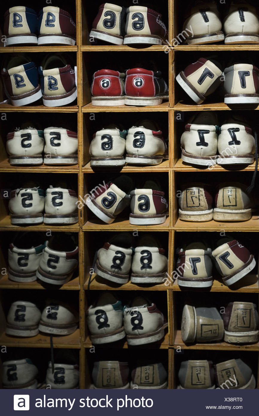 Rack of bowling shoes Stock Photo - Alamy