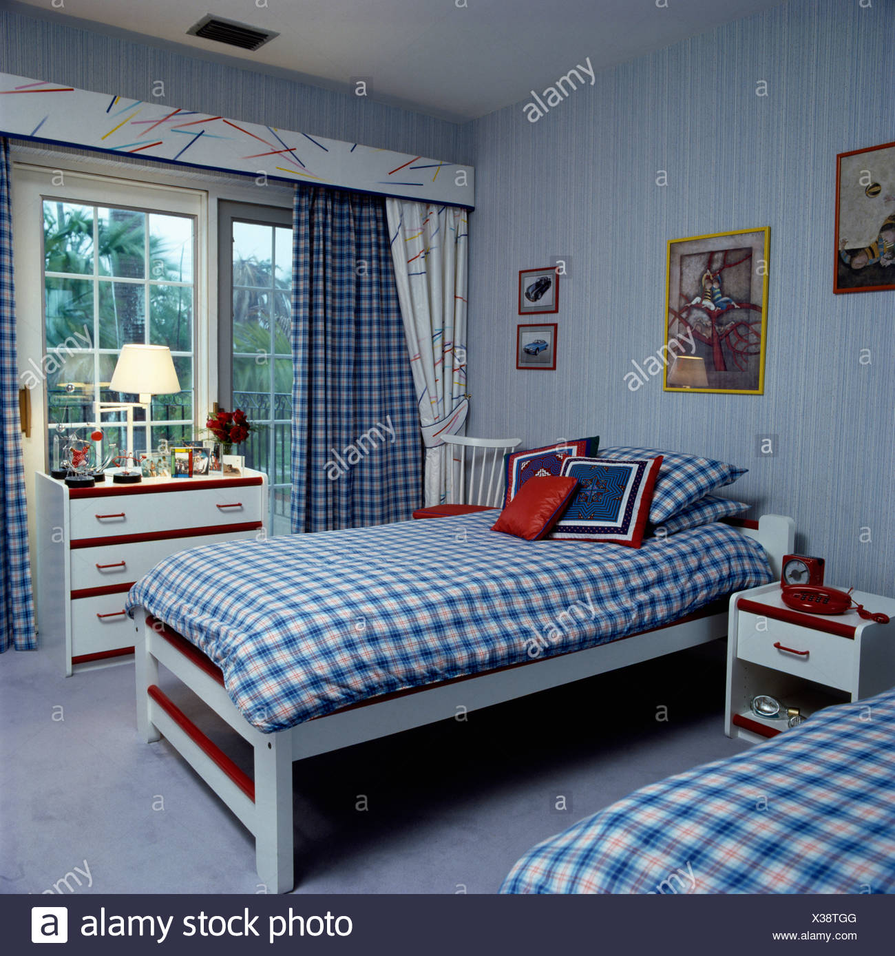 Blue Bedroom With Blue Drapes And Blue And White Check Duvets On